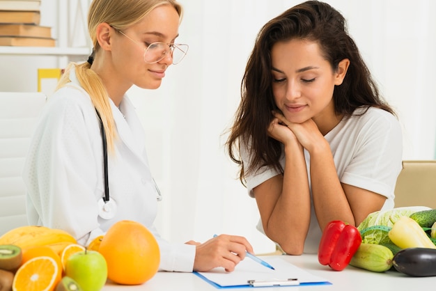 medium shot doctor writing prescription 23 2148302089 1